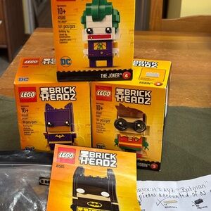 Bundle of FOUR LEGO BATMAN BRICK'H'EADZ; 3 unopened Batman was pre-built.